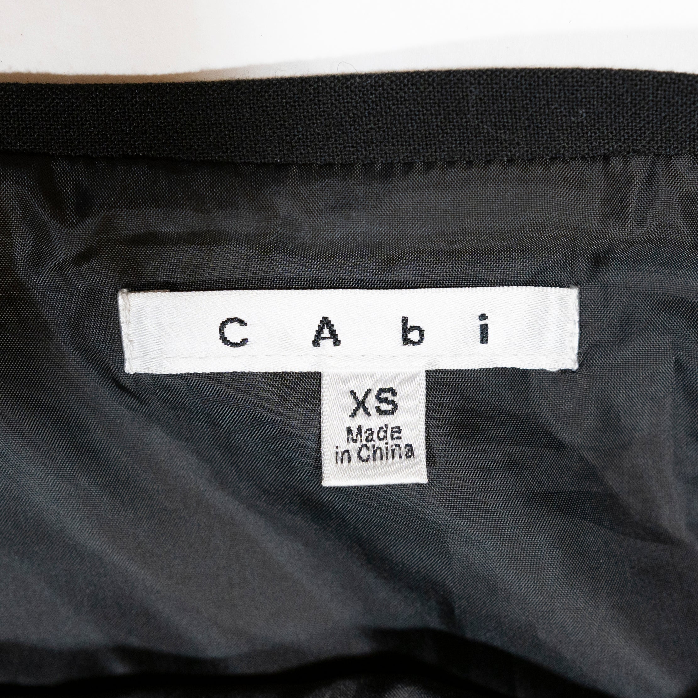 CAbi #926 Stretch Textured Asymmetrical Hem Button Wrap Mini Skirt Black XS