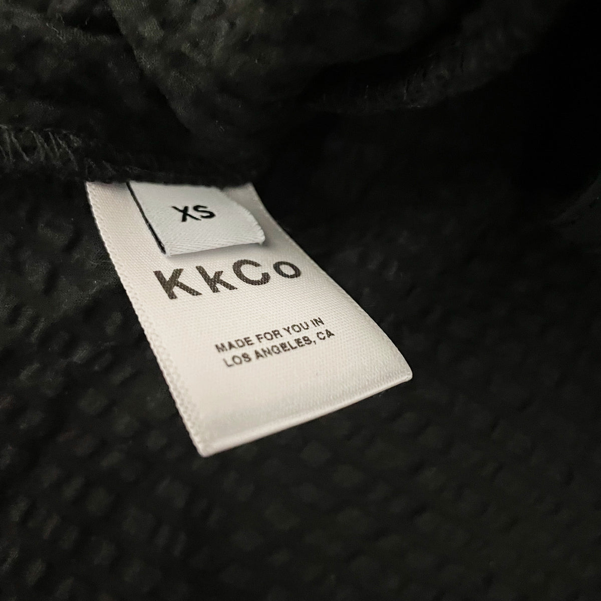 KKCO Climber One Shoulder Ruffle Asymmetrical Hem Textured Blouse Shirt Onyx XS