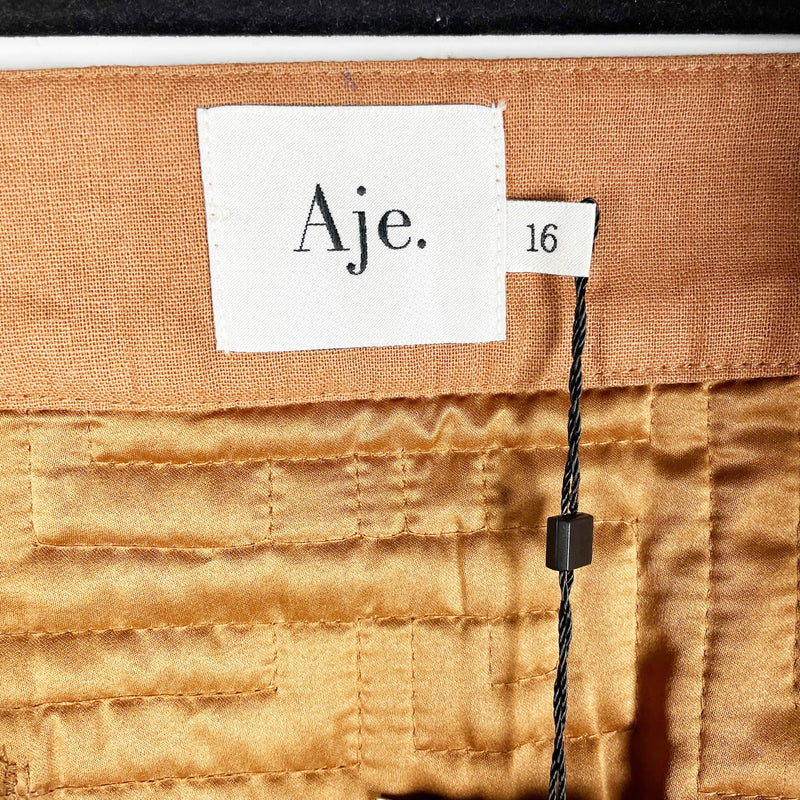 NEW Aje Surrealist Quilted Cotton Linen Texture Front Zip Mini Skirt Tawny Brown